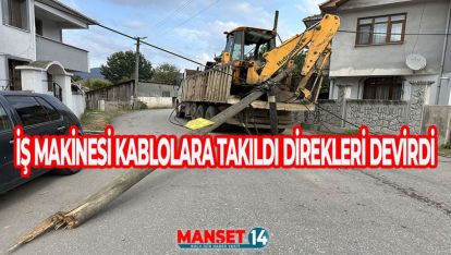 KASASINDAKİ İŞ MAKİNESİ KABLOLARA TAKILAN KAMYON 3 TELEFON DİREĞİNİ DEVİRDİ